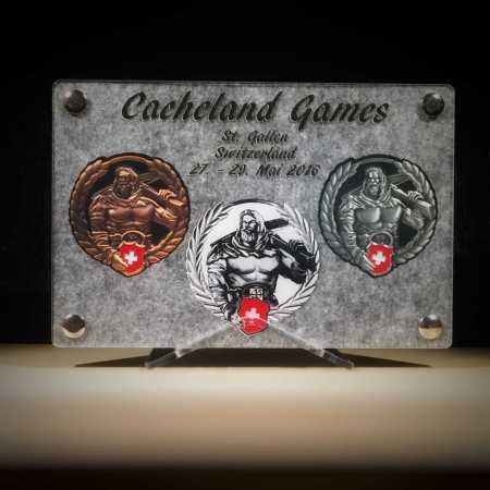Geocoin Tableau - "MEGA Cacheland Games Switzerland"