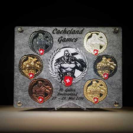 Geocoin Tableau - "MEGA Cacheland Games Switzerland"
